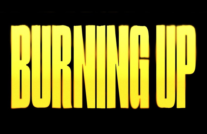 Burning Up in yellow on black