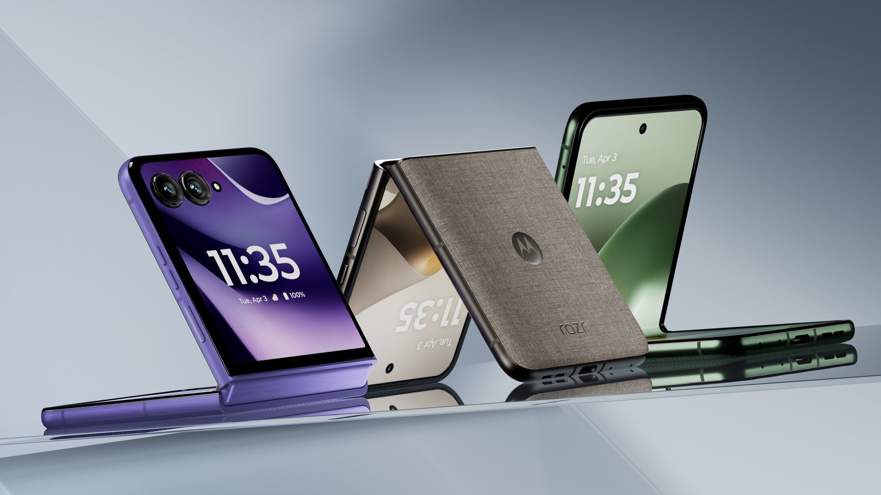 Three Razr phones standing on glass