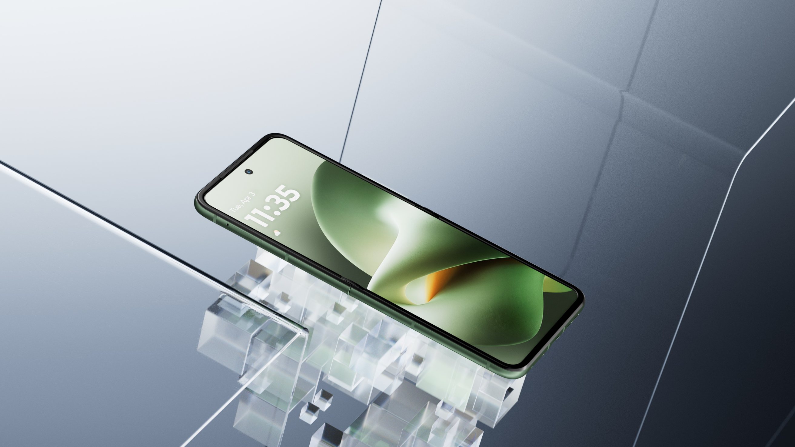 Green Razr lying open on a bed of glass cubes