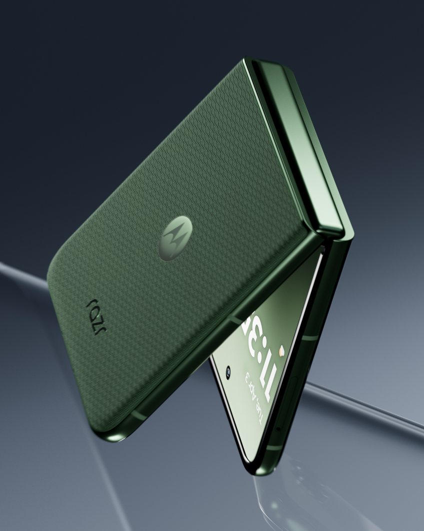 Green Razr Plus tipping open on glass